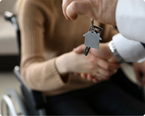 Wheelchair user receiving a new key